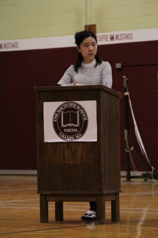 Junior Tira Xia listens as one of her fellow candidates talks.